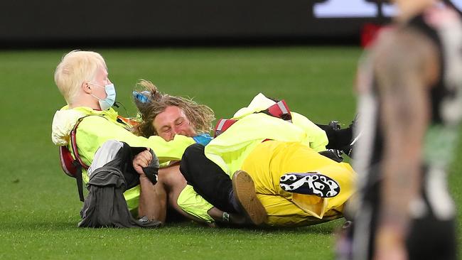 The man is tackled by guards. Picture: Getty