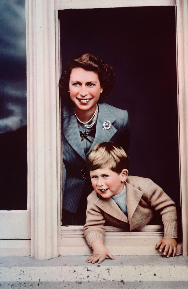 Prince Charles and his mother Princess Elizabeth looking out of a window at Balmoral. Picture: Lisa Sheridan/Studio Lisa/Getty Images