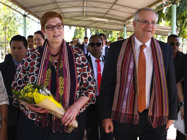 Australian Prime Minister Scott Morrison (centre right) and Australian Foreign Minister Marise Payne arrive in Dili, East Timor, Friday, August 30, 2019. East Timor is celebrating the 20th anniversary of its independence from Indonesia. (AAP Image/Lukas Coch) NO ARCHIVING