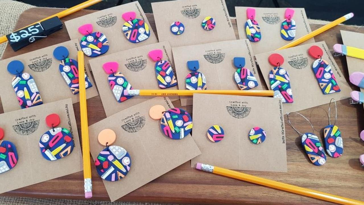 TEACHERS RULE-R: Bundaberg primary school teacher Rebecca Lovejoy made a teachers collection out of polymer clay, featuring earrings with stationery and yellow pencil hair clips.