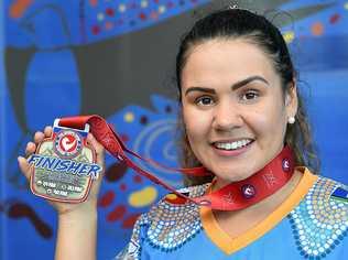 RISING STAR: Brandi Alberts with her triathlon medal from her recent race in Slovakia where she placed fourth. Picture: Alistair Brightman