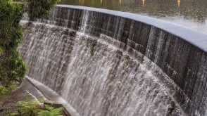 Lake Parramatta ‘waterfall’ on Thursday during heavy rain, which causes the water to spill over the dam wall. Picture: ParraParents Instagram