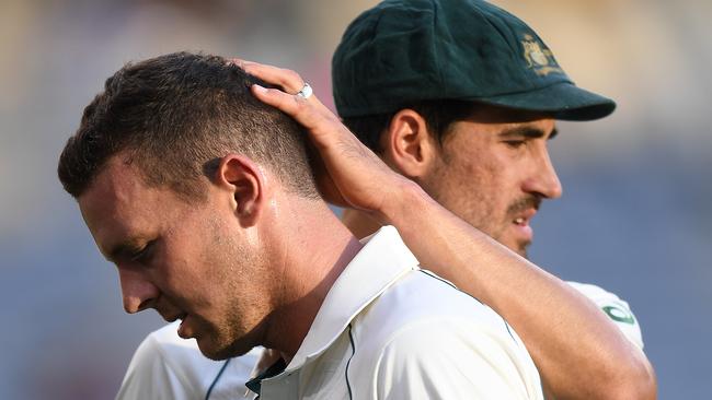 Josh Hazlewood was consoled by Mitchell Starc after injuring his hamstring on day two in Perth. Picture: AAP