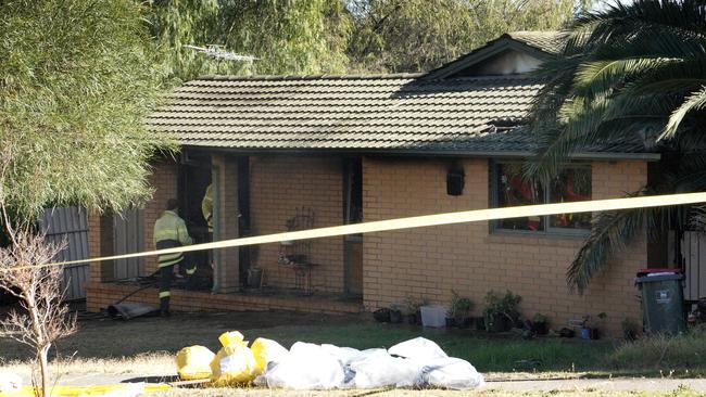 Investigators at the Hackham West property on Saturday. Picture: Dean Martin