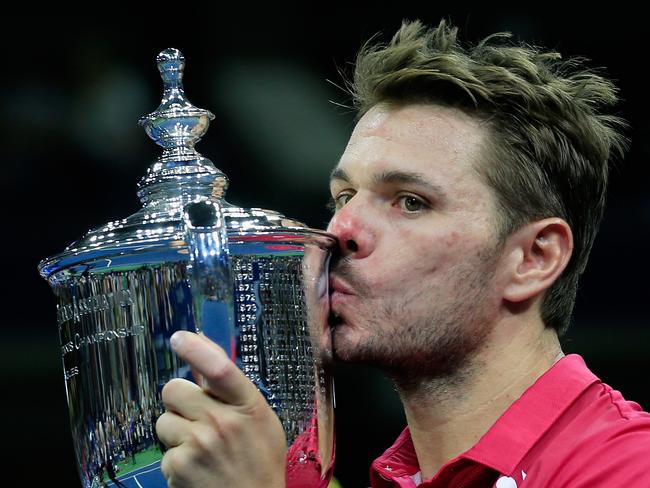 NEW YORK, NY - SEPTEMBER 11: Stan Wawrinka of Switzerland celebrates with the trophy after winning 6-7, 6-4, 7-5, 6-3 against Novak Djokovic of Serbia during their Men's Singles Final Match on Day Fourteen of the 2016 US Open at the USTA Billie Jean King National Tennis Center on September 11, 2016 in the Queens borough of New York City. (Photo by Chris Trotman/Getty Images for USTA)