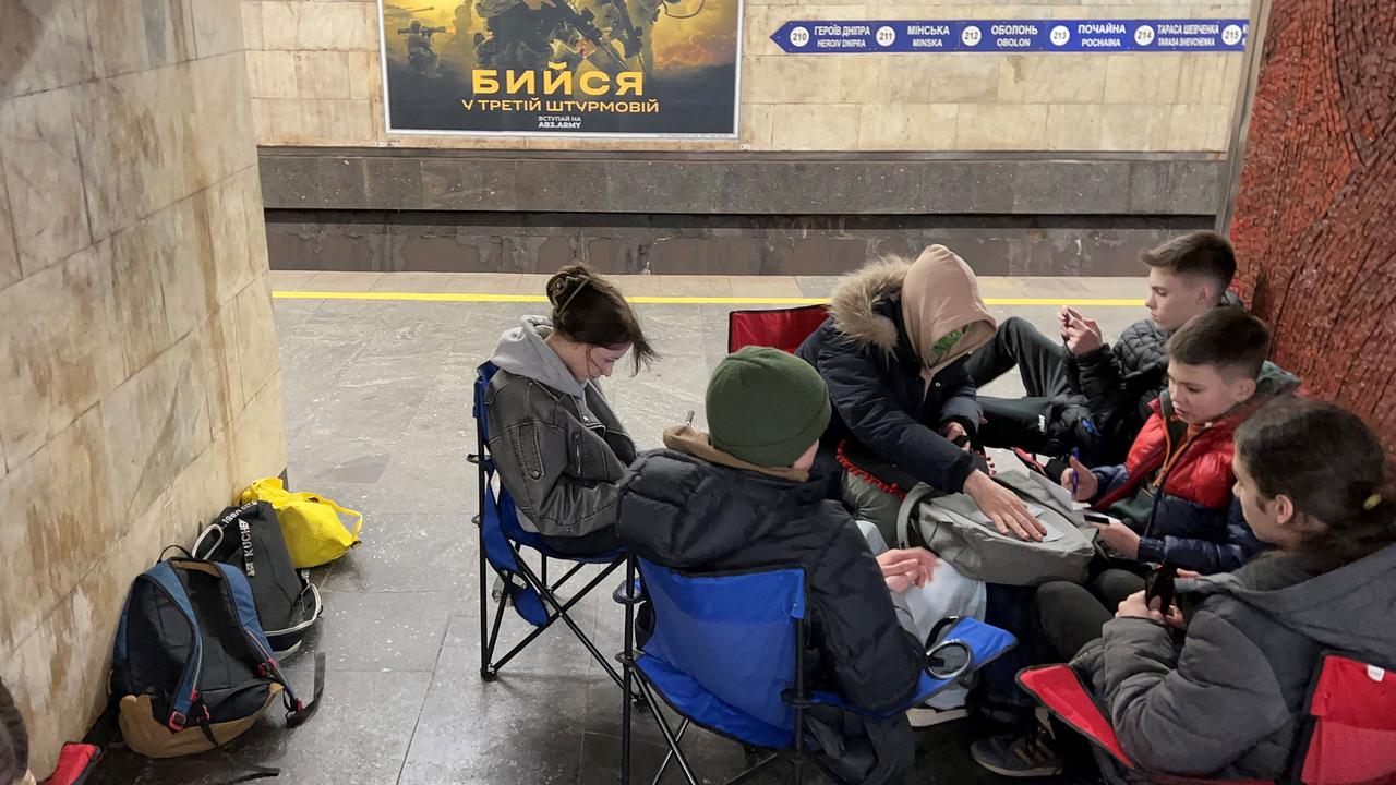 Schoolchildren shelter in an underground metro station during an air raid alarm in Kyiv on March 15. Picture: Sergei SUPINSKY / AFP