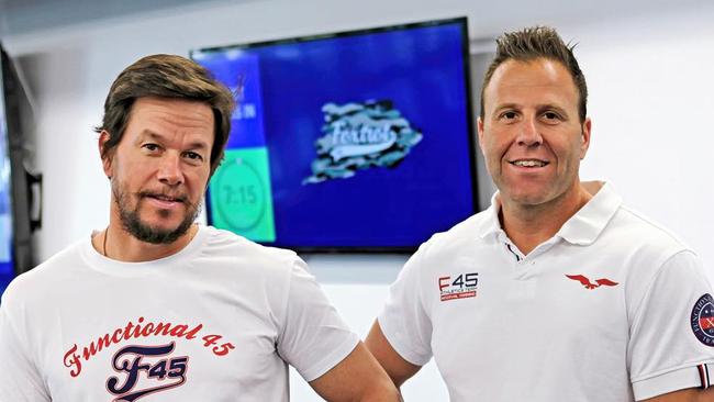 F45 owner Rob Deutsch, right, with actor Mark Wahlberg Picture: Instagram / F45 Training