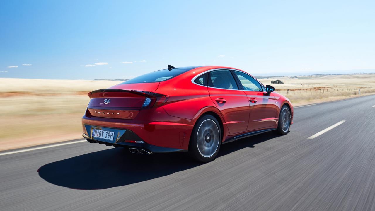 A sweeping fastback roofline calls to mind Porsche’s Panamera.