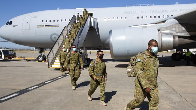 Australian Defence Force personnel arriving in Melbourne to help out with the new hotel quarantine program.