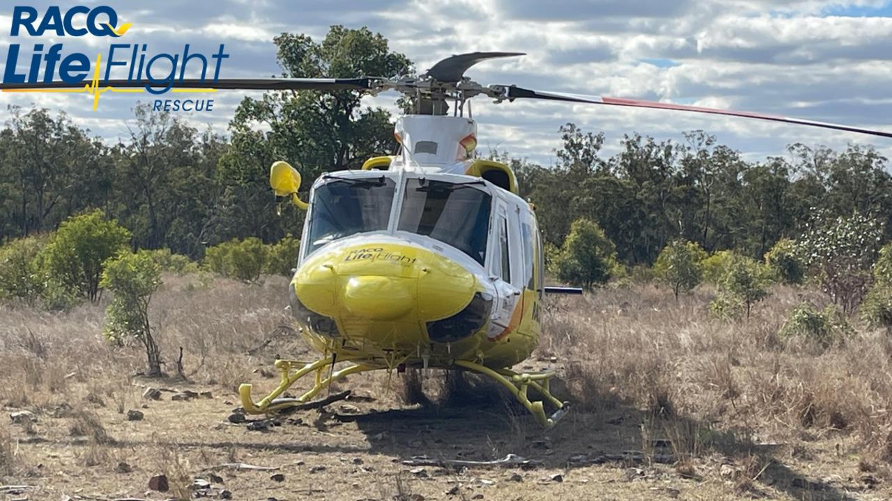 The RACQ LifeFlight helicopter was forced to land in a paddock about 100m from the scene of the crash.