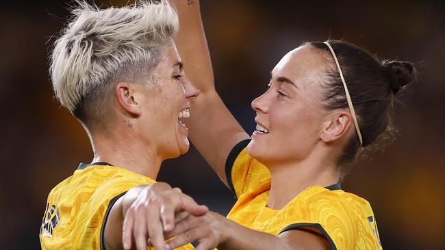 MELBOURNE, AUSTRALIA - FEBRUARY 28: Michelle Heyman of the Matildas celebrates a goal with team mare Caitlin Foord during the AFC Women's Olympic Football Tournament Paris 2024 Asian Qualifier Round 3 match between Australia Matildas and Uzbekistan at Marvel Stadium on February 28, 2024 in Melbourne, Australia. (Photo by Darrian Traynor/Getty Images)