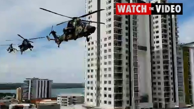 Military helicopters were filmed flying low through Darwin CBD