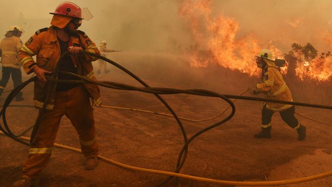 RFS firefighters battle a spot fire in Hillville during catastrophic fire conditions. Picture: Getty Images