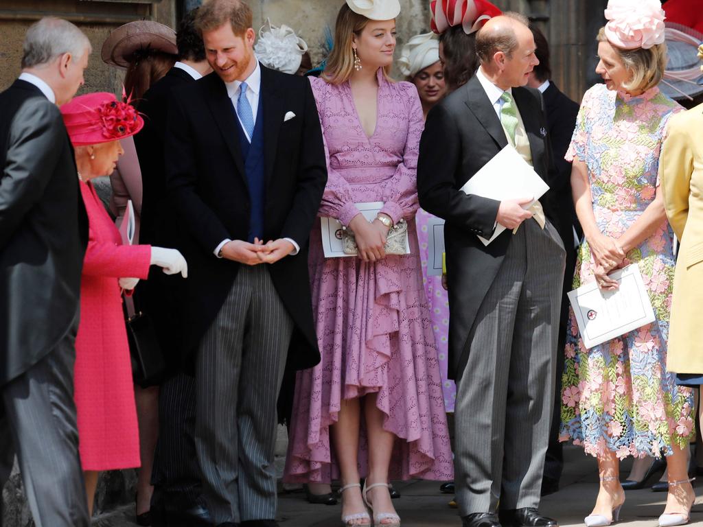 Britain's Queen Elizabeth II speaks with Britain's Prince Harry, Duke of Sussex (3L) and Britain's Prince Andrew, Duke of York (L) as they leave St George's Chapel. Picture: AFP