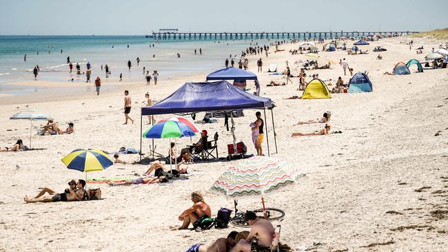 Not everyone went shopping … some people hit Henley Beach. Picture: Mike Burton