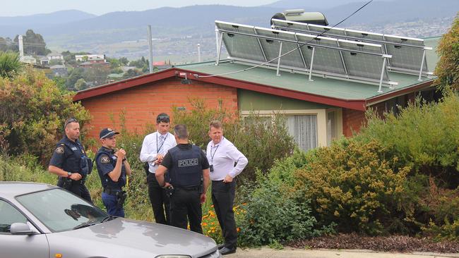 Tasmania Police outside the New World Avenue house that was the scene of a 16-hour siege. Picture: BRUCE MOUNSTER