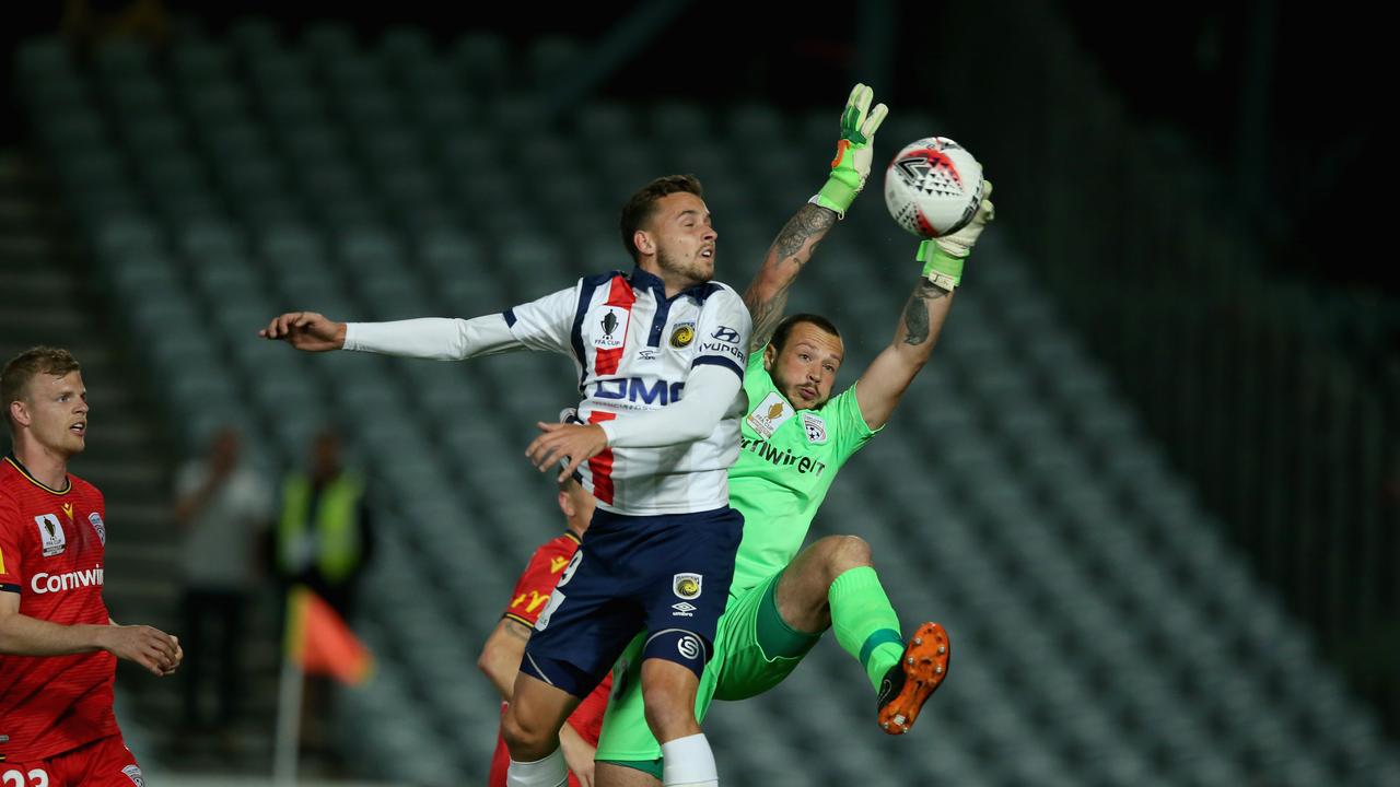 Isaac Richards of Adelaide United (R) is hanging up his goalkeeping gloves for a radical career change.