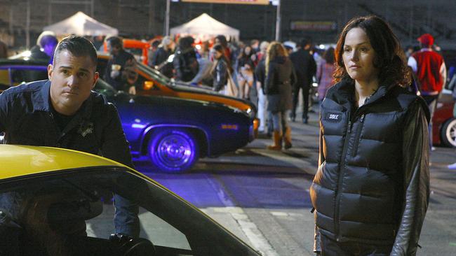 George Eads and Jorja Fox in CSI: Crime Scene Investigation.