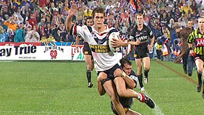 Scott Sattler cuts down Todd Byrne just 20 metres from the try line during the 2003 grand final.