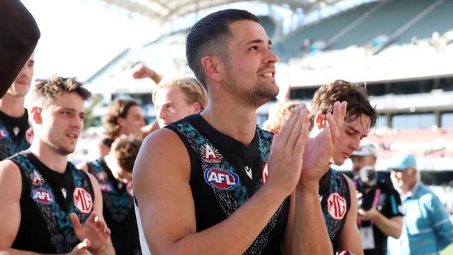 ADELAIDE, AUSTRALIA – APRIL 22: Ryan Burton of the Power applauds the crowd after the win during the 2023 AFL Round 06 match between the Port Adelaide Power and the West Coast Eagles at Adelaide Oval on April 22, 2023 in Adelaide, Australia. (Photo by Sarah Reed/AFL Photos via Getty Images)