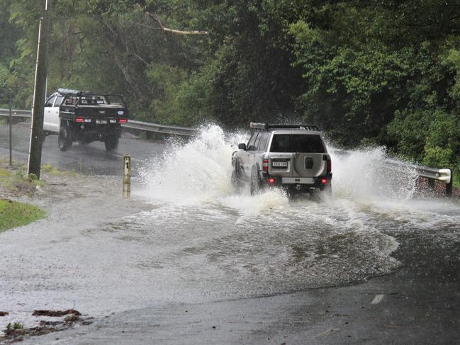 The torrential rain on the Mid North Coast has caused minor flooding across the region. In Upper Orara some roads are already being inundated with water. Photo: Tim Jarrett