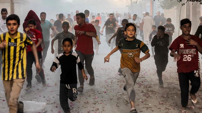 Children flee from a bombardment in Rafah. Picture: Mohammed Abed/AFP