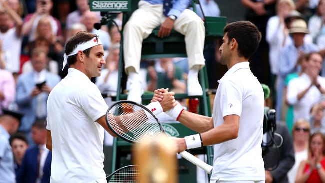 Roger Federer (left) congratulates 2019 Wimbledon champion Novak Djokovic. Picture: Getty Images