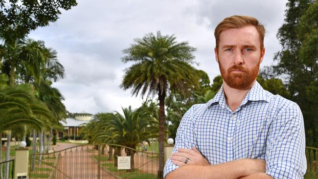 Councillor Joe Wilkinson outside the gates to the Arundel Hills Country Club. Picture: John Gass