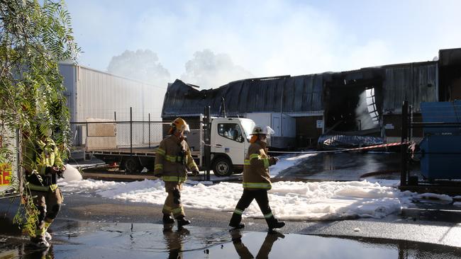 Fire crews at the scene of the business fire at Edwardstown. Picture: Dean Martin