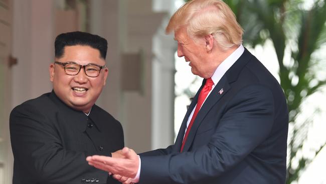 Kim Jong-un is all smiles as the world watches on. Picture: AFP