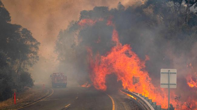 CFA tackling spot fires along the Great Alpine road just outside Omeo. Picture: Jason Edwards