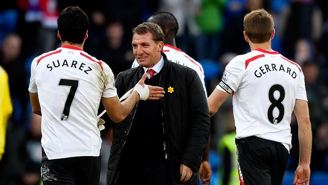 CARDIFF, WALES - MARCH 22: Luis Suarez of Liverpool is congratulated by his manager Brendan Rogers after the final whistle during the Barclays Premier League match between Cardiff City and Liverpool at Cardiff City Stadium on March 22, 2014 in Cardiff, Wales. (Photo by Ben Hoskins/Getty Images)