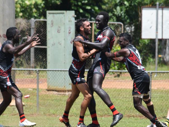 Majak Daw celebrates his first goal for Tiwi Bombers against PINT on Bathurst Island. Picture: Alison McGowan / AFLNT Media.