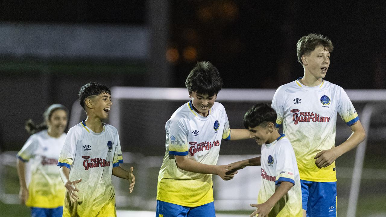 USQ FC players celebrate as the game against Rockville Rovers White goes into extra time in Football Queensland Darling Downs Community Juniors U13 Div 1 Maroon grand final at Clive Berghofer Stadium, Friday, August 30, 2024. Picture: Kevin Farmer