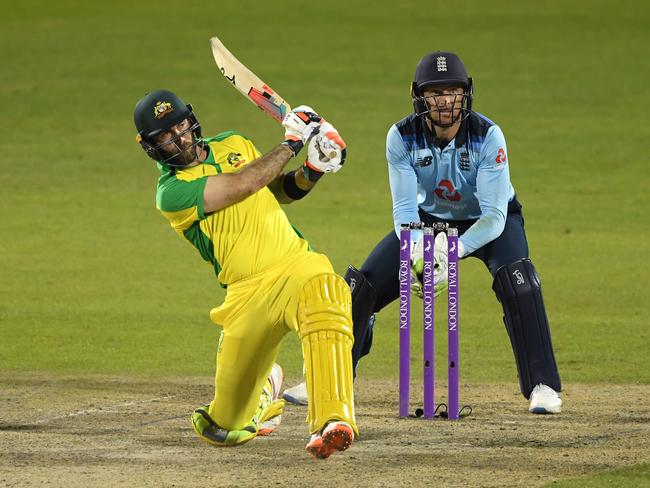 MANCHESTER, ENGLAND - SEPTEMBER 16: Glenn Maxwell of Australia hits a six t watched on by Jos Buttler of England  during the 3rd Royal London One Day International Series match between England and Australia  at Emirates Old Trafford on September 16, 2020 in Manchester, England. (Photo by Stu Forster/Getty Images for ECB)