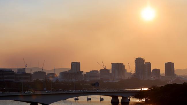 Smoke from a burn-off hangs over Brisbane on Sunday. Picture: Steve Pohlner