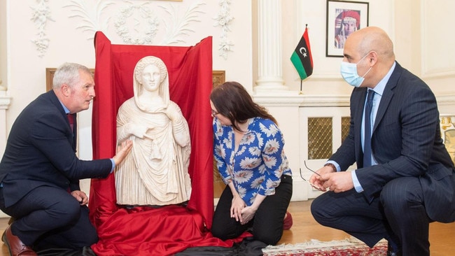 Higgs at the Libyan Embassy with the retrieved funerary statue, which depicts Demeter or Persephone. Picture: Alamy/The Times