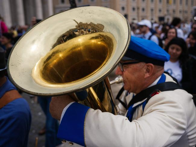 A musician plays after the Regina Caeli prayer led by the Pope. Picture: AFP