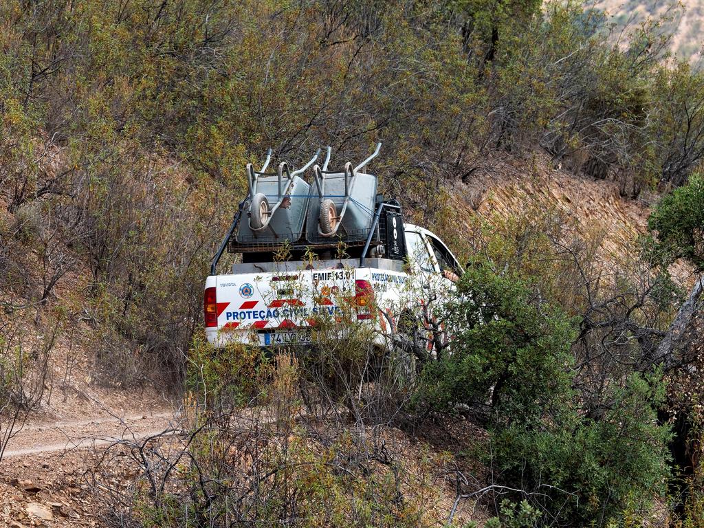 An emergency services vehicle carries wheelbarrows to the search site. Picture: Reuters