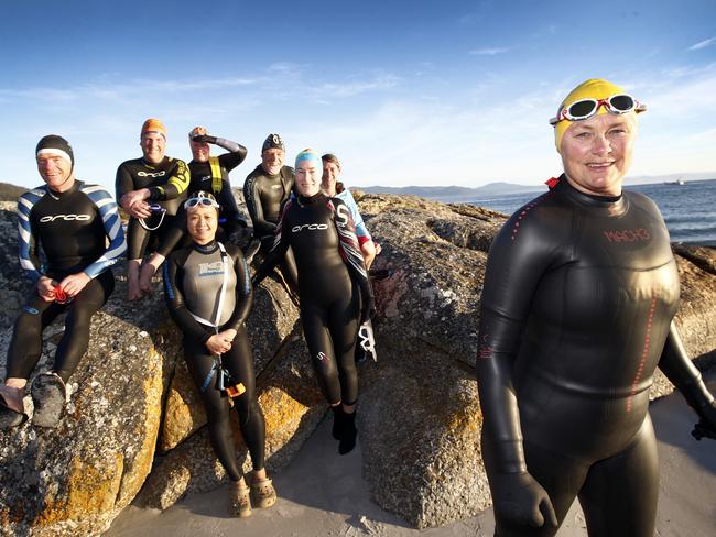 The resident swim club, led by Australian Olympic swimmer Shane Gould, right, goes for a 40-minute swim every day in the sea off Bicheno. Picture: KIM EISZELE