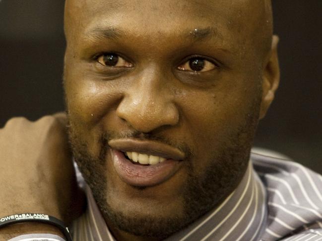 FILE - In this July 31, 2009, file photo, Los Angeles Lakers' Lamar Odom speaks to the media during a news conference after the Lakers signed Odom to a multi-year NBA basketball contract, in El Segundo, Calif. Odom spent most of his 14-year NBA career in Los Angeles with the Lakers and Clippers, becoming a fan favorite before he sought even more fame with the Kardashians. Odom, who was embraced by teammates and television fans alike for his Everyman approach to fame, was found face-down and alone Tuesday, Oct. 13, 2015, after spending four days at the Love Ranch, a legal Nevada brothel. (AP Photo/Jeff Lewis, File)