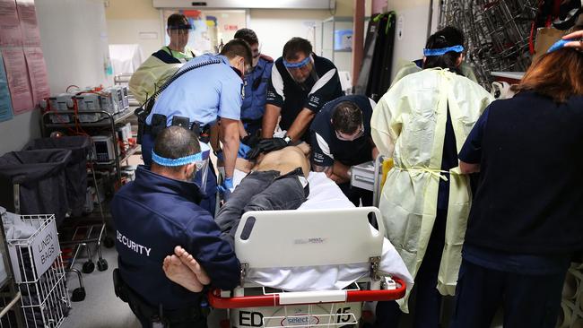 A young man on an ice bender is brought to an emergency department in a state of psychosis. Picture: Gary Ramage