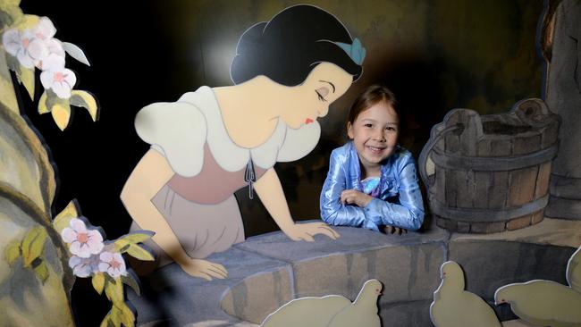 Kit Li, 5, with Snow White at the opening of the Disney: The Magic of Animation exhibition at ACMI. Picture: Andrew Henshaw