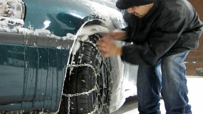 Practising fitment of tyre chains can make it easier to fit them in an emergency. Picture: AP