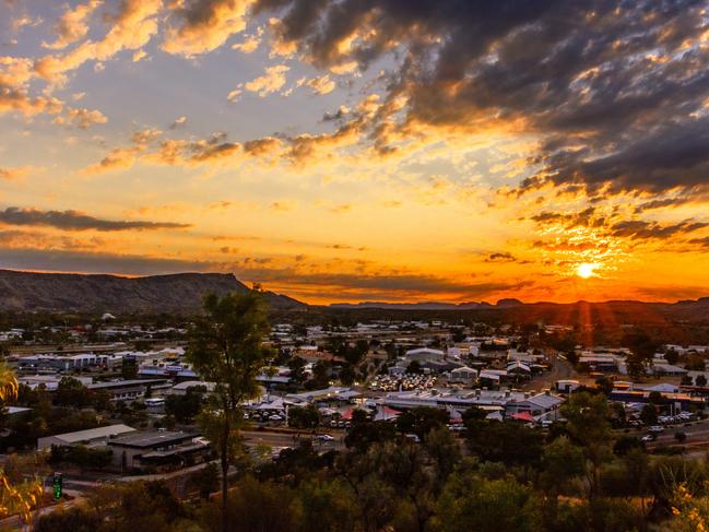 The sun sets over Alice Springs, viewed from Anzac Hill.A thriving, spirited outback centre, Alice Springs is as famous for the personality of its locals and contemporary and traditional art as the natural wonders, including the stunning Larapinta Trail and the MacDonnell Ranges, which surround it.