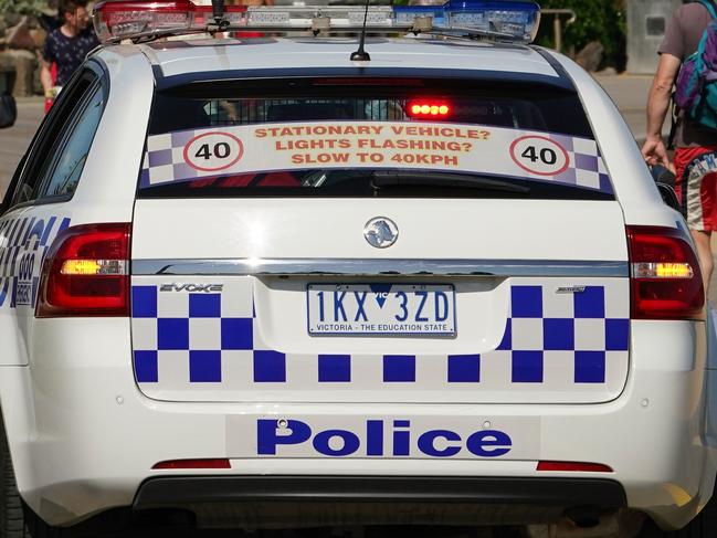 A Police car patrols St Kilda Beach in Melbourne, Saturday, March 28, 2020. Port Phillip City Council has clamped down on large groups accessing all of its beaches including the popular St Kilda Beach. A shutdown of non-essential services is in effect Australia wide in a bid to slow the spread of the coronavirus (COVID-19) disease. (AAP Image/Scott Barbour) NO ARCHIVING