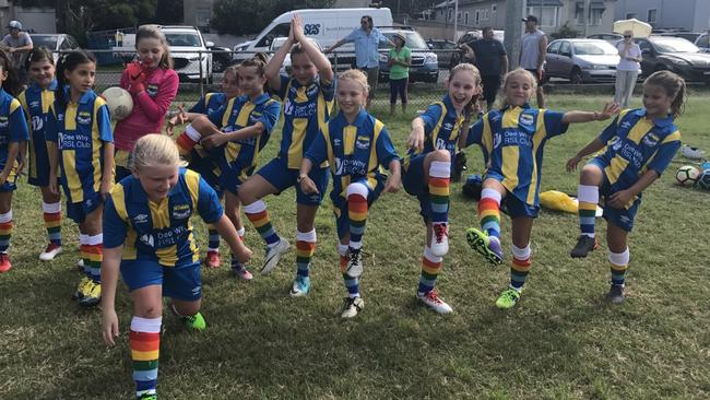 This photo of an U10 side from Dee Why FC was posted on the club's Facebook page alongside the result of their match. Even though they lost 10-5, the girls still have smiles on their faces Picture: Supplied.