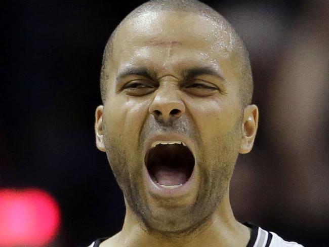 San Antonio Spurs' Tony Parker (9), of France, celebrates following an NBA basketball game against the Dallas Mavericks, Tuesday, Oct. 28, 2014, in San Antonio. San Antonio won 101-100. (AP Photo/Eric Gay)