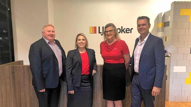 NEW ERA: LJ Hooker state director Steve Mutton (left), Mackay business manager Tara Smyth, principal licensee Fum Walters and the company's executive chairman Janusz Hooker mark the opening of LJ Hooker's Mackay branch. Picture: Mitchell Bazley