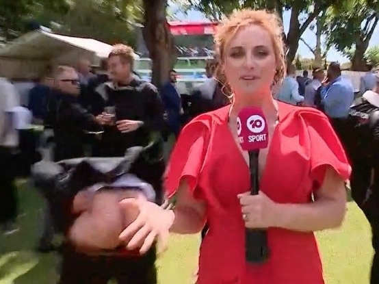 Not the live cross she was hoping for – Channel 10 reporter mooned live on air during Melbourne Cup post race coverage in Ascot, Perth. Picture: Channel 10